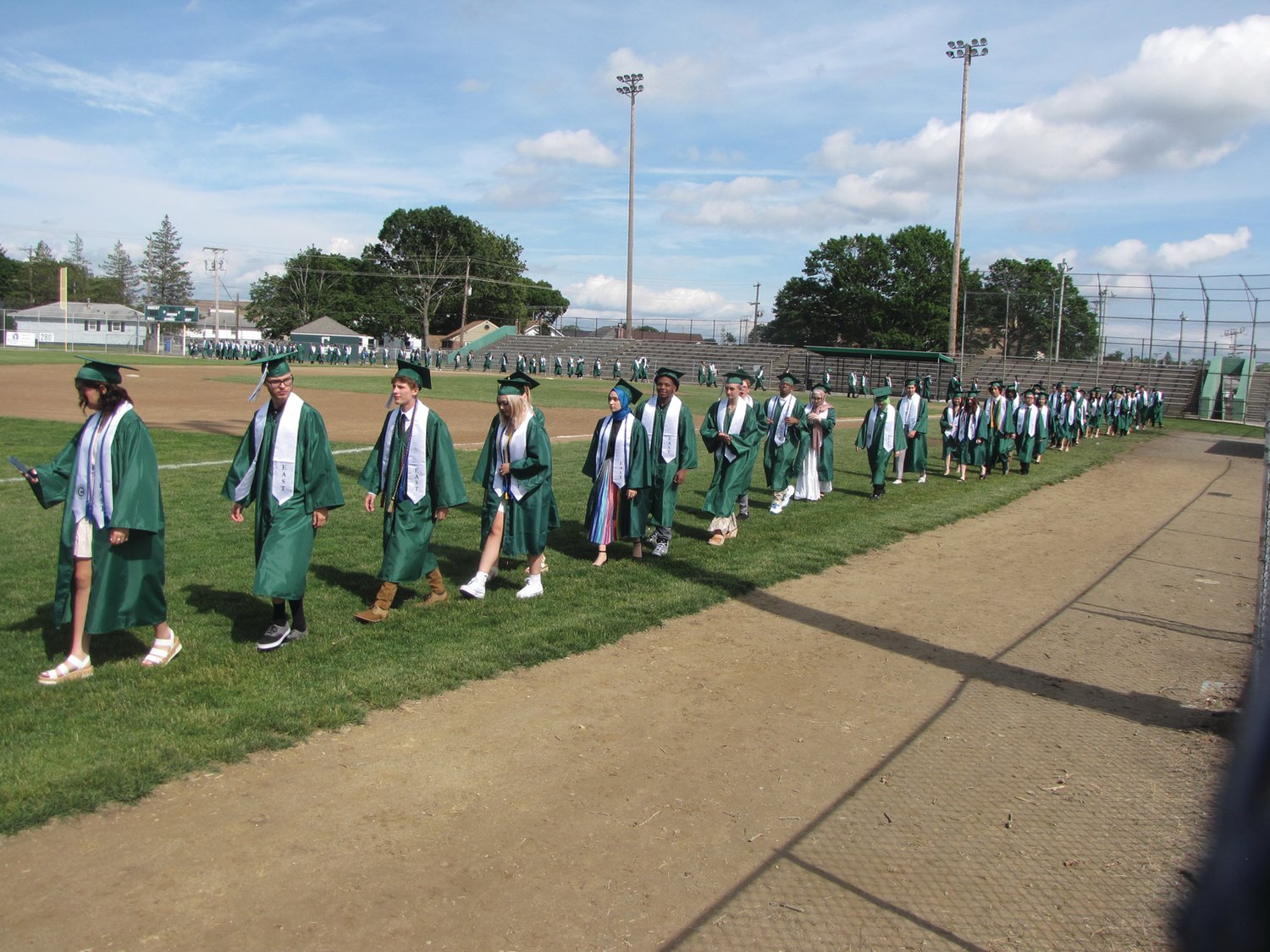 READY TO GO: Before the start of Saturday’s graduation ceremony at Cranston Stadium, the members of Cranston East’s class of 2021 lined up along the edge of the baseball field.